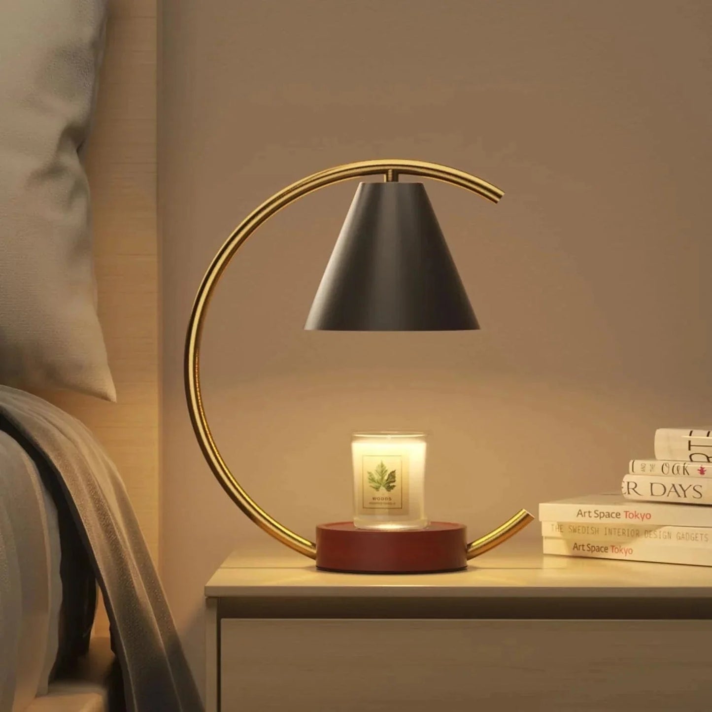Decorative table lamp with a candle on a nightstand in a bedroom setting.