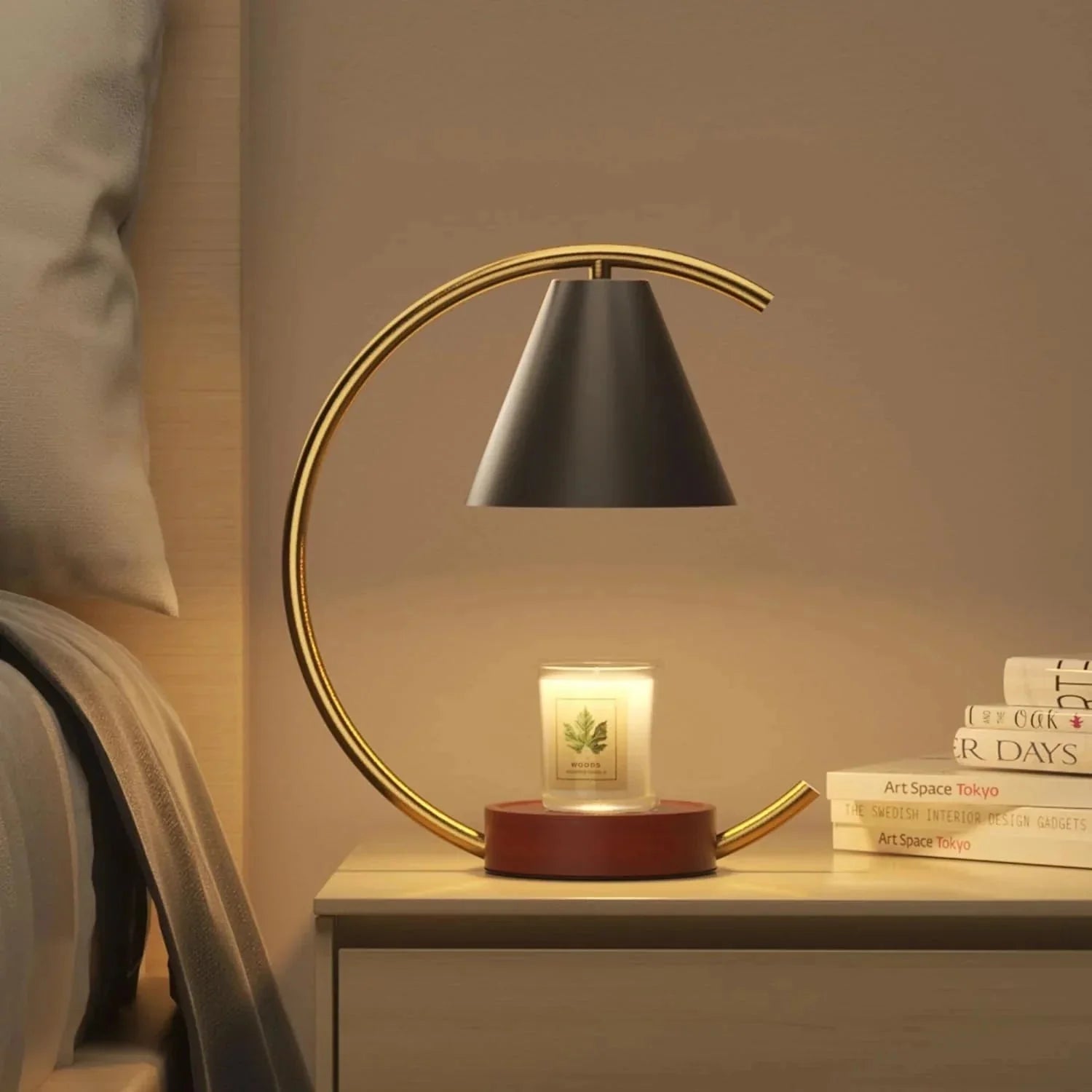 Decorative table lamp with a candle on a nightstand in a bedroom setting.