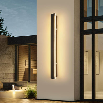 Modern outdoor wall light fixture on a building exterior.