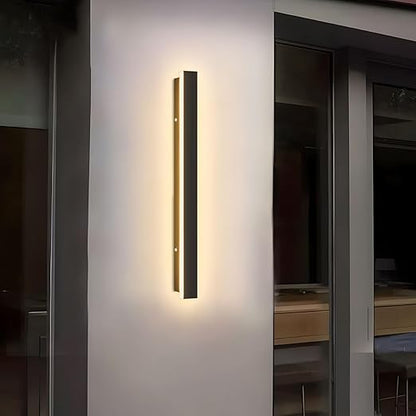 Modern wall-mounted light fixture on a neutral wall