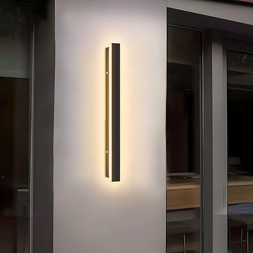 Modern wall-mounted light fixture on a neutral wall